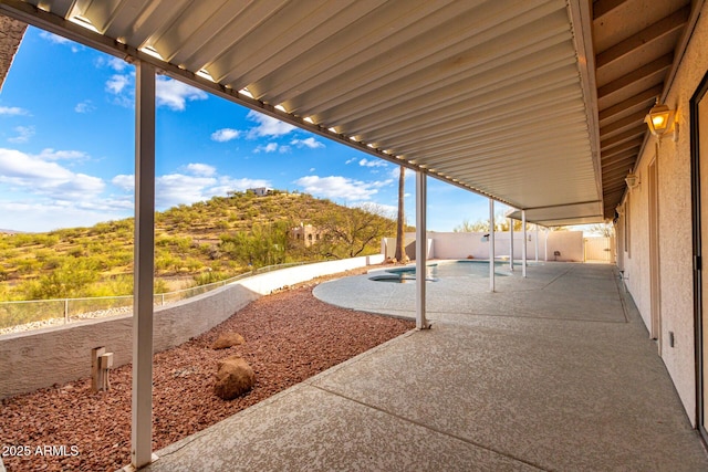 view of patio / terrace featuring a fenced in pool