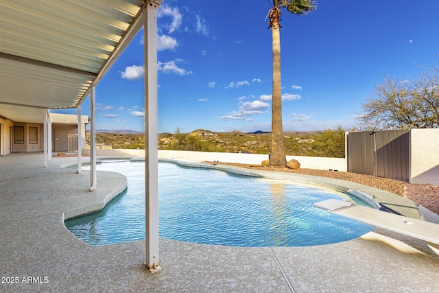 view of pool featuring a diving board and a patio area