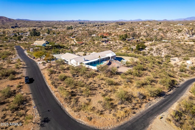 birds eye view of property with a mountain view