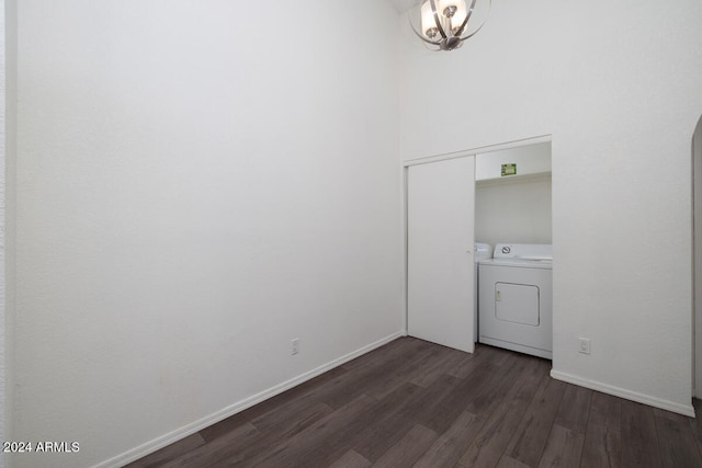 interior space with separate washer and dryer and dark hardwood / wood-style floors