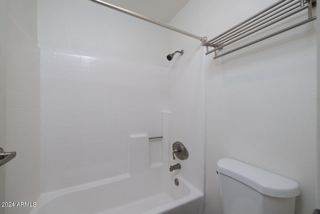 bathroom featuring shower / bath combination and toilet