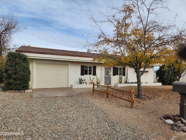 single story home featuring a garage