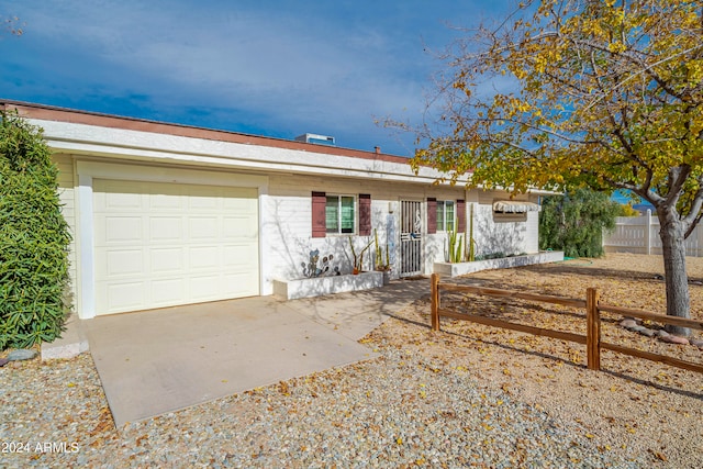 single story home featuring a garage