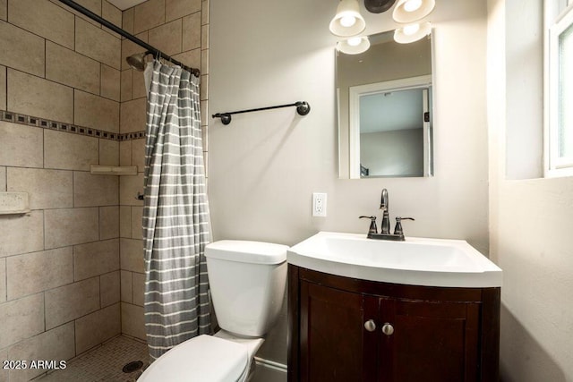 bathroom featuring toilet, a shower with curtain, and vanity