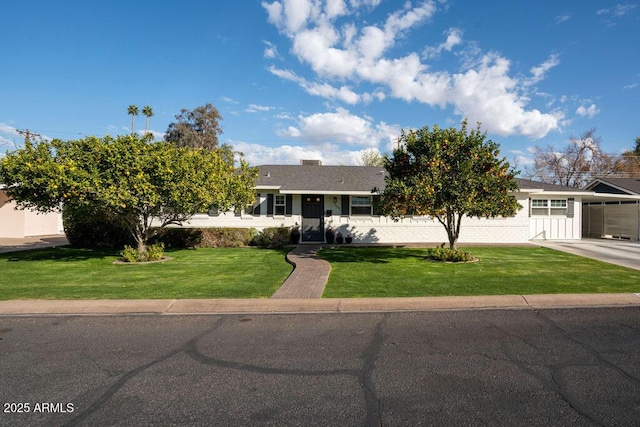 view of front of home featuring a garage and a front yard