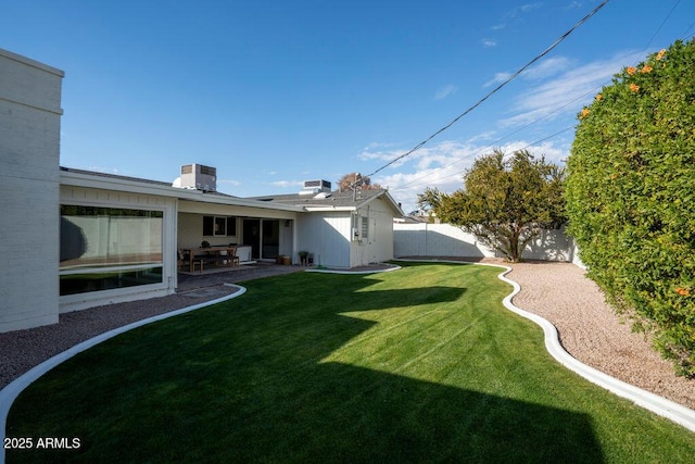 view of yard featuring a patio and central AC