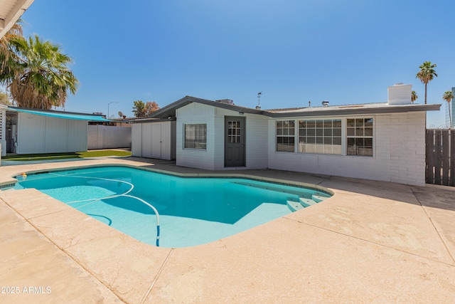 view of pool with a fenced in pool, fence, and a patio