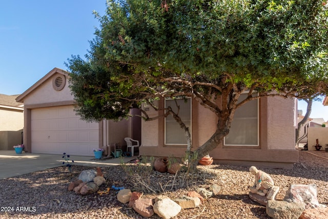 1871 E Westchester Dr, Chandler, AZ 85249 - view of front facade featuring an attached garage, driveway, and stucco siding