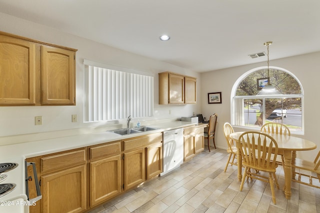 kitchen with dishwasher, pendant lighting, electric stove, and sink