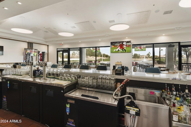 kitchen featuring a raised ceiling