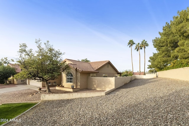 view of property exterior with a garage