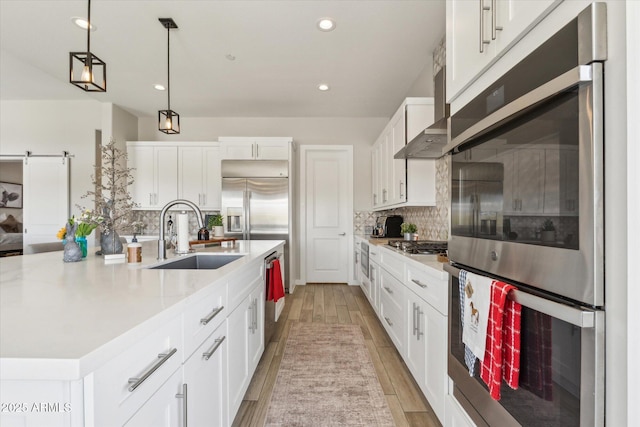 8396 E Granite Pass Rd, Scottsdale, AZ 85266 - kitchen featuring a sink, appliances with stainless steel finishes, white cabinets, wall chimney exhaust hood, and tasteful backsplash