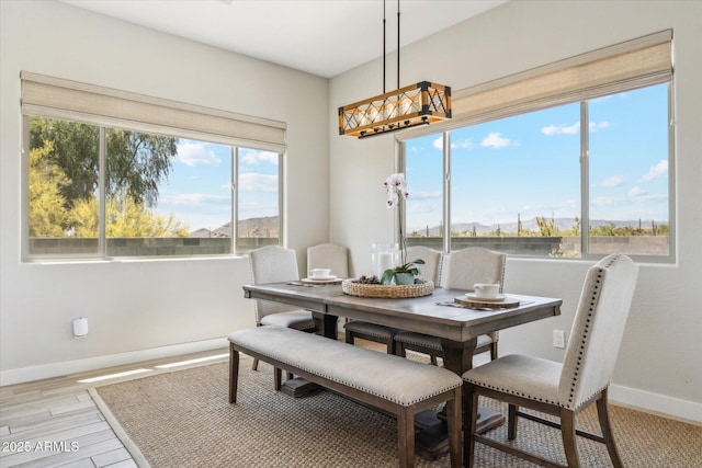 8396 E Granite Pass Rd, Scottsdale, AZ 85266 - dining room with baseboards, a chandelier, and light wood-type flooring