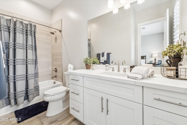 8396 E Granite Pass Rd, Scottsdale, AZ 85266 - full bath with vanity, toilet, shower / bath combination with curtain, and wood finished floors