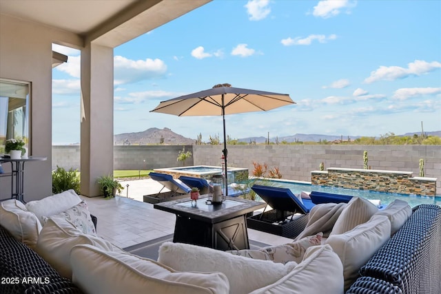 8396 E Granite Pass Rd, Scottsdale, AZ 85266 - fenced backyard with outdoor lounge area, a pool with connected hot tub, a mountain view, and a patio