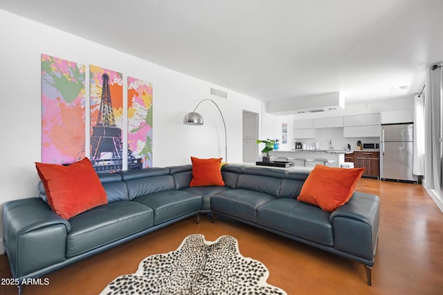 living area with concrete floors