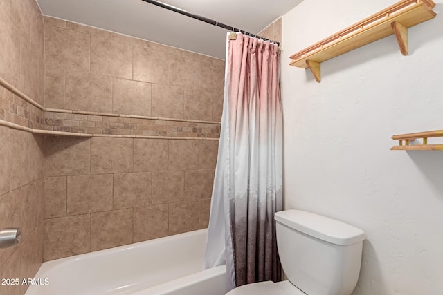 bathroom featuring toilet and shower / bath combo with shower curtain