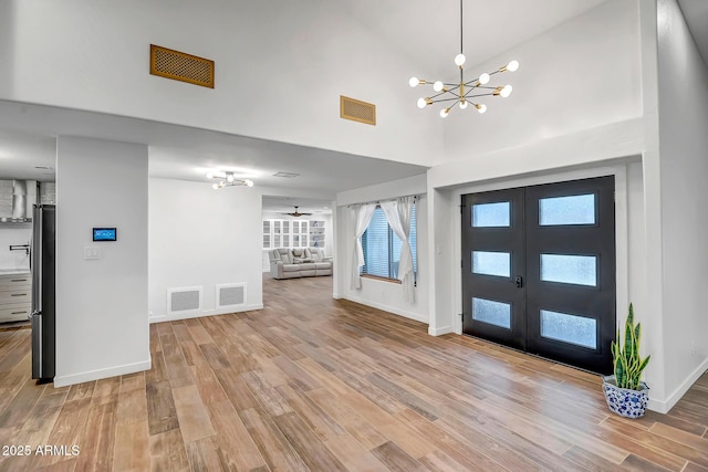 35005 N Central Ave, Phoenix, AZ 85086 - foyer with french doors, light wood finished floors, baseboards, and a towering ceiling