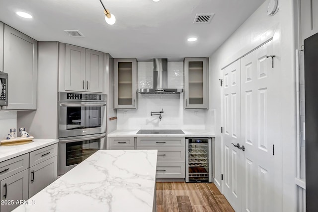 35005 N Central Ave, Phoenix, AZ 85086 - kitchen featuring wine cooler, appliances with stainless steel finishes, wall chimney exhaust hood, gray cabinetry, and recessed lighting