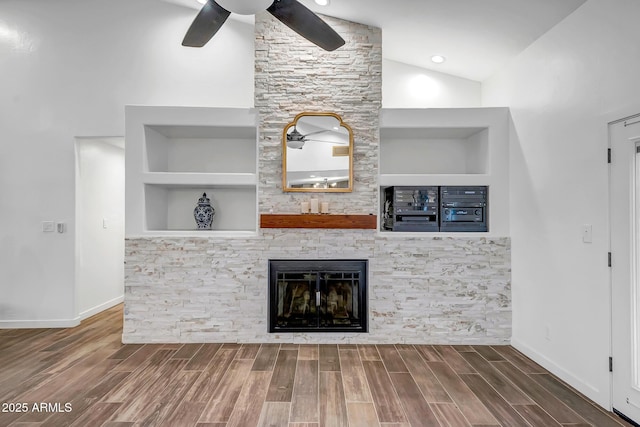 35005 N Central Ave, Phoenix, AZ 85086 - unfurnished living room with ceiling fan, lofted ceiling, wood finished floors, a fireplace, and baseboards
