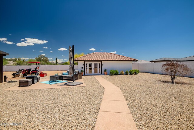 35005 N Central Ave, Phoenix, AZ 85086 - rear view of property featuring french doors, an outdoor hangout area, a fenced backyard, and a tile roof