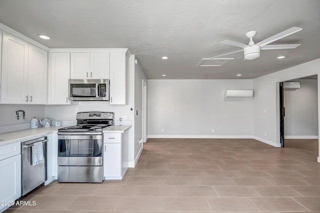 35005 N Central Ave, Phoenix, AZ 85086 - kitchen with appliances with stainless steel finishes, an AC wall unit, light countertops, white cabinetry, and ceiling fan