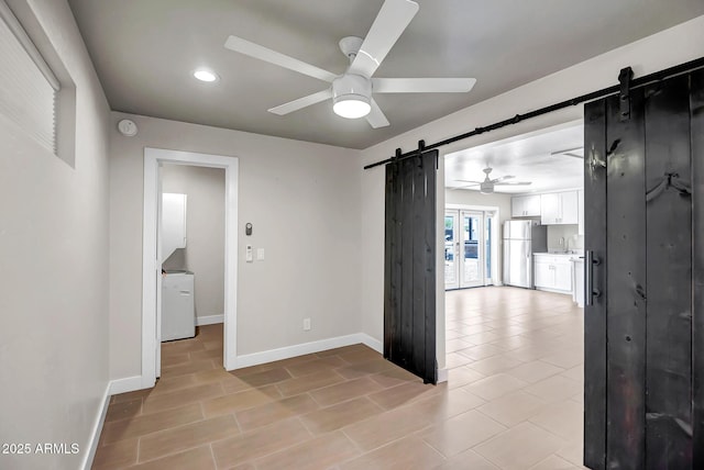 35005 N Central Ave, Phoenix, AZ 85086 - spare room featuring a barn door, a ceiling fan, baseboards, recessed lighting, and a smoke detector