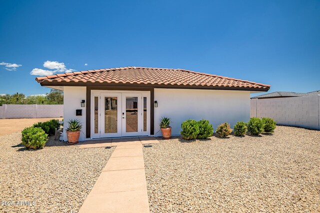 35005 N Central Ave, Phoenix, AZ 85086 - view of front of house with french doors, a tiled roof, fence, and stucco siding