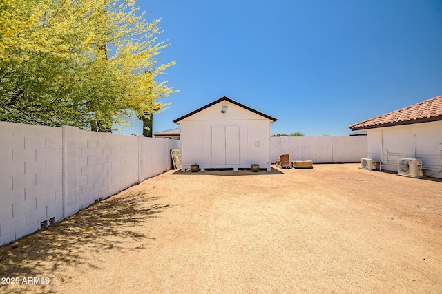 35005 N Central Ave, Phoenix, AZ 85086 - fenced backyard featuring a storage shed and an outbuilding
