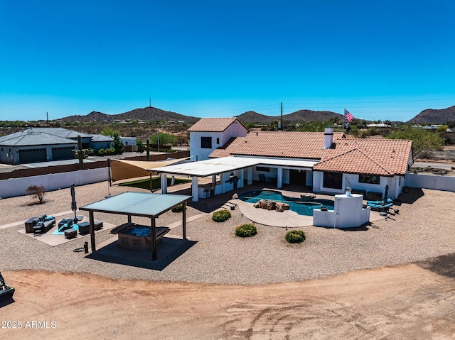 35005 N Central Ave, Phoenix, AZ 85086 - rear view of property featuring a mountain view, a tile roof, a fenced backyard, and a jacuzzi