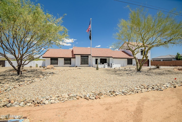 35005 N Central Ave, Phoenix, AZ 85086 - view of front of home featuring a tile roof, stucco siding, and fence