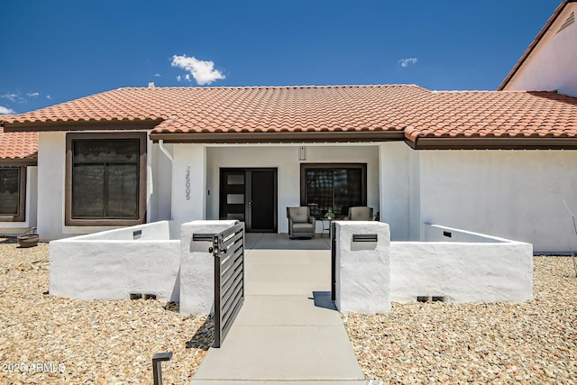 35005 N Central Ave, Phoenix, AZ 85086 - entrance to property with covered porch, stucco siding, a gate, and a tile roof