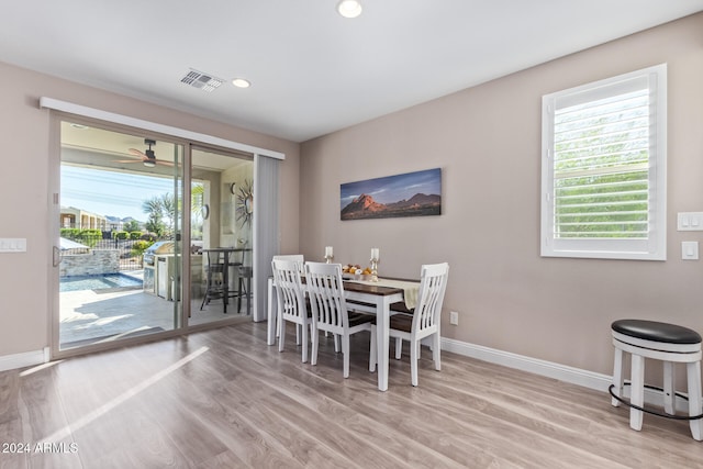 dining area featuring light hardwood / wood-style flooring and ceiling fan