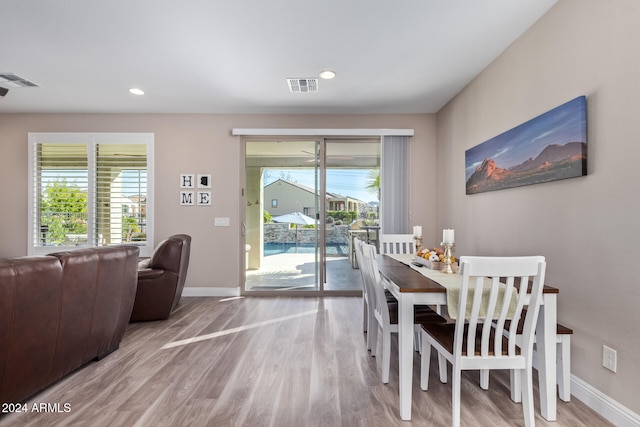 dining space featuring wood-type flooring