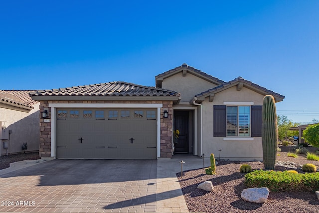 view of front of property with a garage