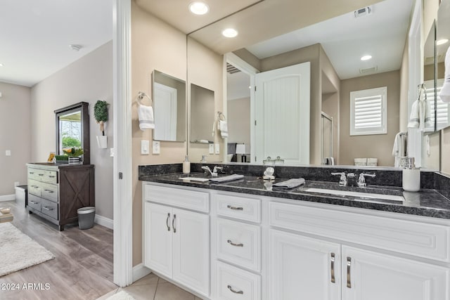 bathroom featuring hardwood / wood-style floors and vanity