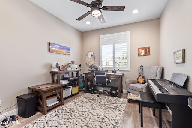 home office with ceiling fan and hardwood / wood-style floors