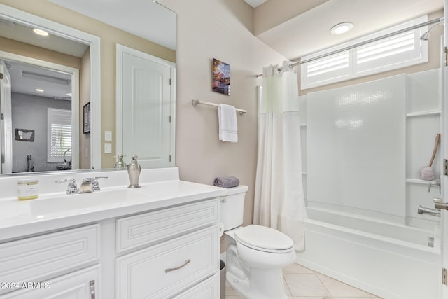 full bathroom featuring tile patterned floors, vanity, shower / tub combo, and toilet