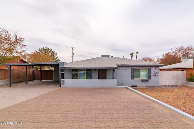 rear view of house with a carport