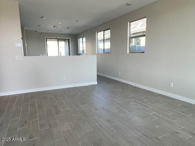 empty room featuring dark wood-type flooring