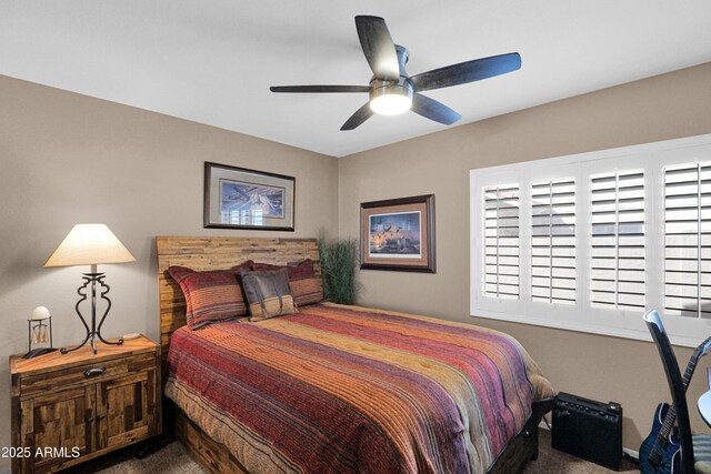 bedroom with multiple windows, carpet, and ceiling fan