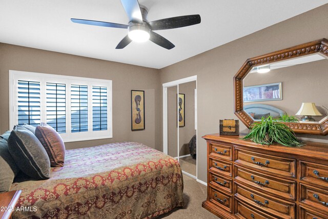 carpeted bedroom featuring a ceiling fan