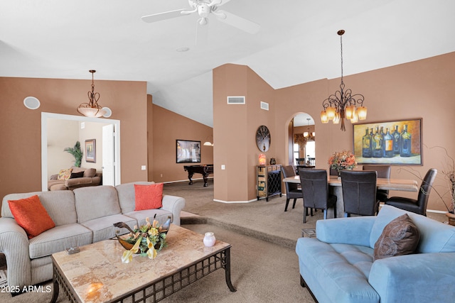 carpeted living area with visible vents, a ceiling fan, arched walkways, baseboards, and vaulted ceiling