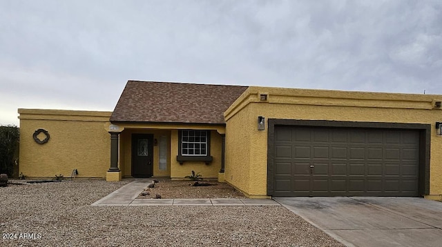 ranch-style home with a garage