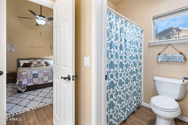 bathroom featuring ceiling fan and toilet