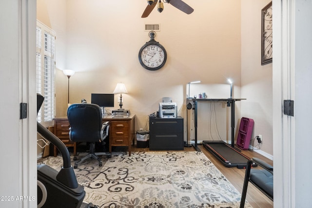 office space with light hardwood / wood-style flooring and ceiling fan