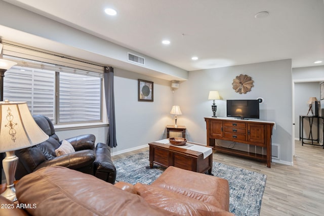 living room with light hardwood / wood-style floors