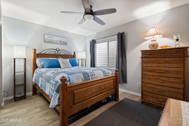 bedroom with ceiling fan and light wood-type flooring