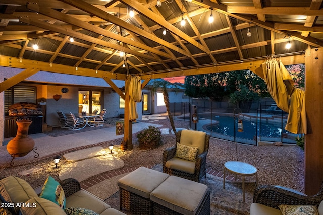 view of patio with a fenced in pool and a gazebo