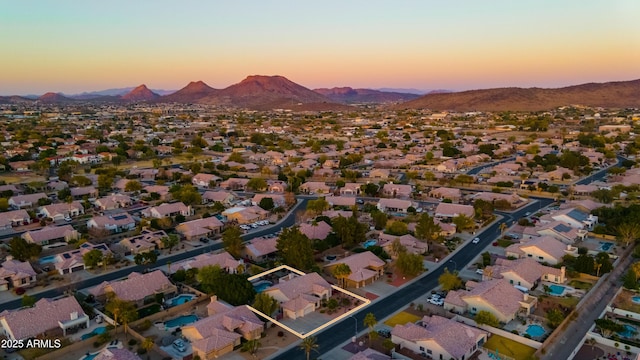 aerial view at dusk with a mountain view